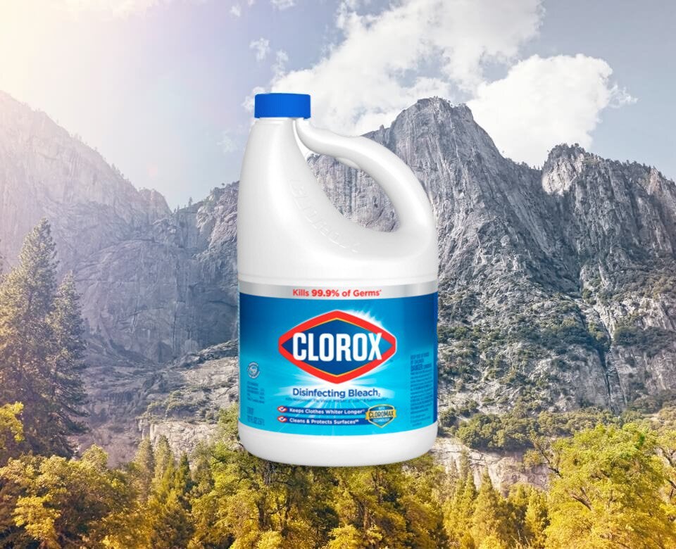 a clorox bottle against a mountain range