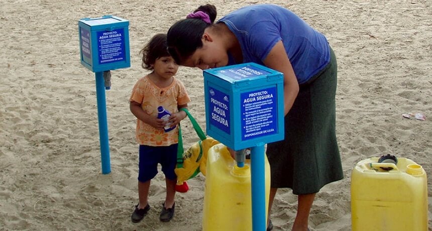 a woman and child collecting water