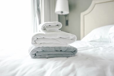 Towels On Bed In Hotel Room
