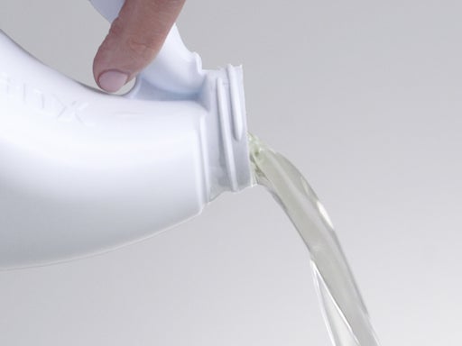 bleach pouring from bottle